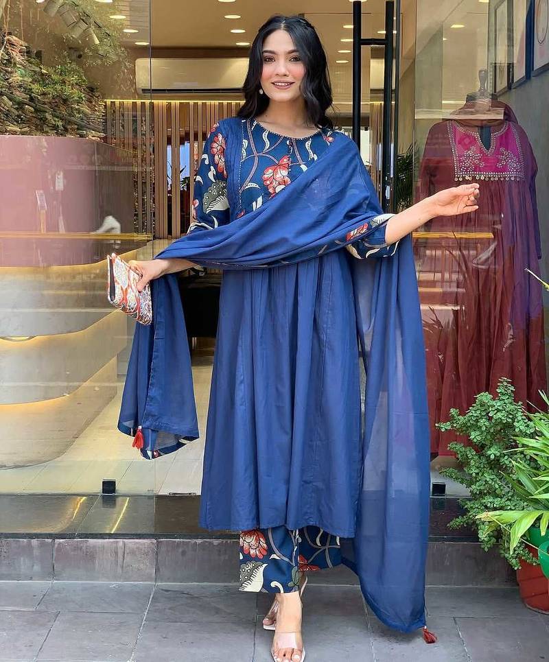 Beautiful jaipuri a blue colored cotton anarkali kurta set with printed trousers and a solid blue dupatta.