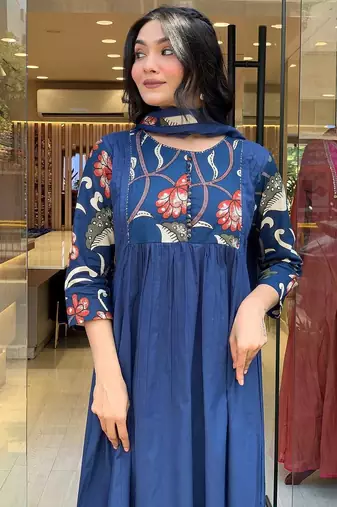 Beautiful jaipuri a blue colored cotton anarkali kurta set with printed trousers and a solid blue dupatta.