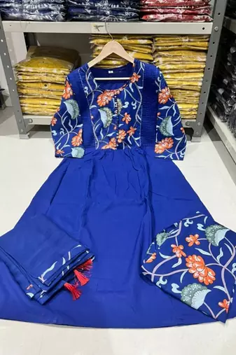 Beautiful jaipuri a blue colored cotton anarkali kurta set with printed trousers and a solid blue dupatta.