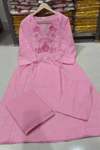 Beautiful jaipuri a pink pure cotton kurta set with a floral yoke design and aari work detailing.