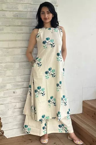Beautiful jaipuri off-white a-line  with a teal and light green floral block print kurta with wide leg palazzos.