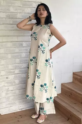 Beautiful jaipuri off-white a-line  with a teal and light green floral block print kurta with wide leg palazzos.