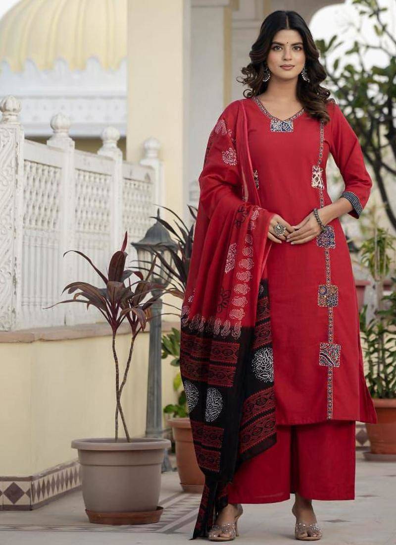 Beautiful jaipuri a red cotton straight kurta set adorned with traditional patch work and hand katha work.