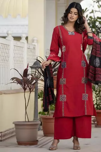 Beautiful jaipuri a red cotton straight kurta set adorned with traditional patch work and hand katha work.