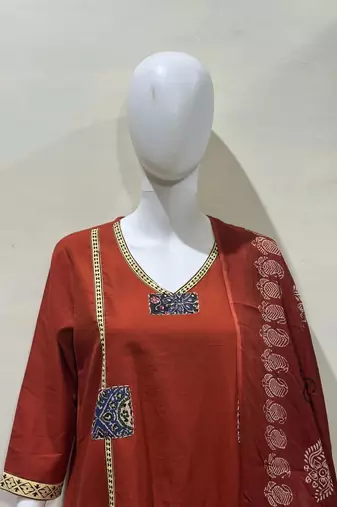 Beautiful jaipuri a mustard cotton straight kurta set adorned with traditional patch work and hand katha work.