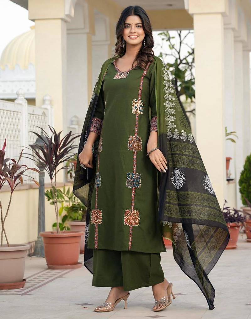 Beautiful jaipuri a dark green cotton straight kurta set adorned with traditional patch work and hand katha work.