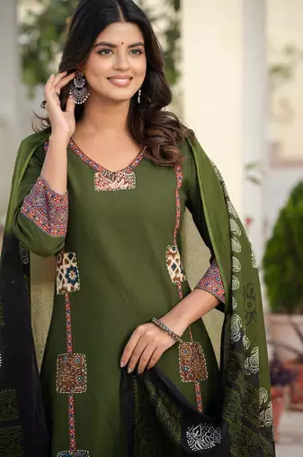 Beautiful jaipuri a dark green cotton straight kurta set adorned with traditional patch work and hand katha work.