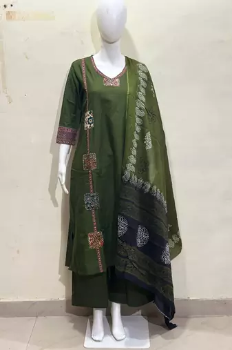 Beautiful jaipuri a dark green cotton straight kurta set adorned with traditional patch work and hand katha work.