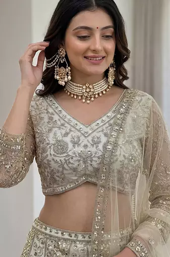 off-white net lehenga with cording and sequins work