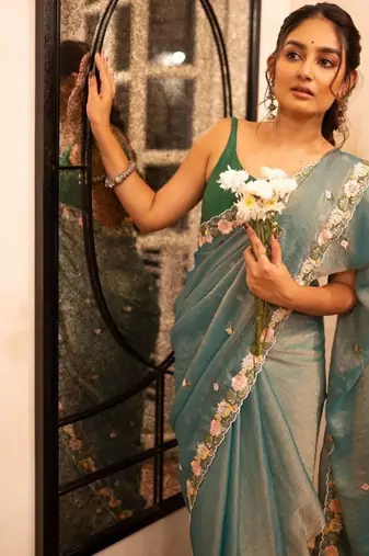 teal silk floral embroidered saree with cutwork border