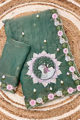 teal silk floral embroidered saree with cutwork border