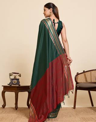 dark green silk blend saree with zari stripes and contrast pallu 3