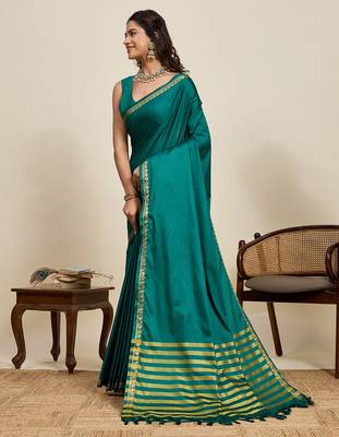 green silk blend saree with gold zari border and striped pallu 2