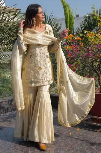cream chinon sharara set with embroidered short kurti and dupatta