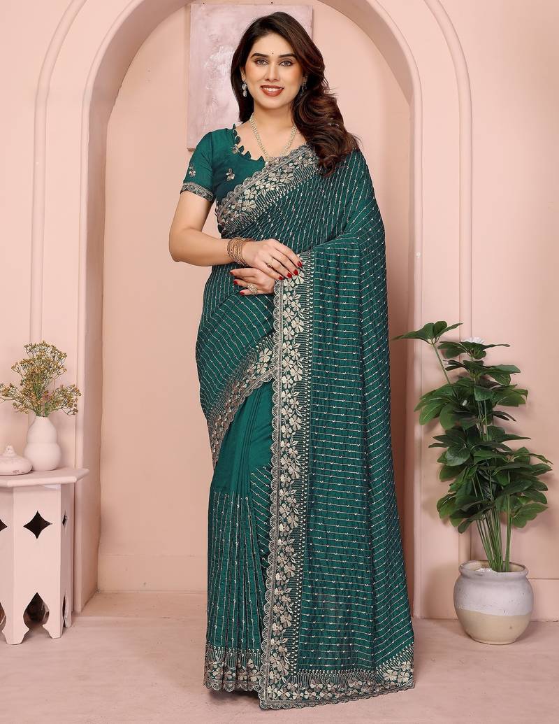 Green vichitra silk saree with sequence embroidery work and matching blouse piece