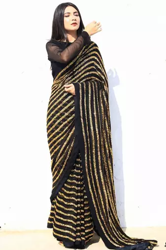 golden colour heavy sequence work all over work with fitting satin lace border