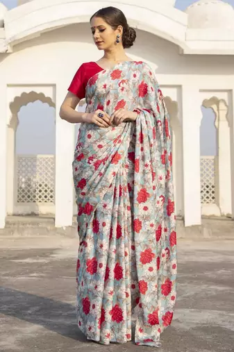 light blue floral printed satin saree with red blouse piece