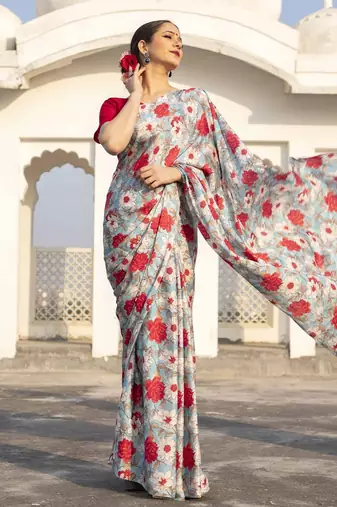 light blue floral printed satin saree with red blouse piece