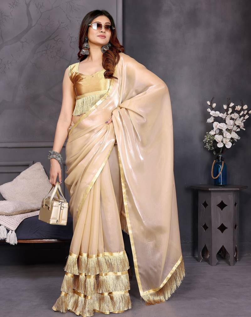 Resham sutra cream silk blend tassel saree with satin gold blouse piece