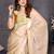 Resham sutra cream silk blend tassel saree with satin gold blouse piece