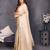 Resham sutra cream silk blend tassel saree with satin gold blouse piece