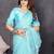 Resham sutra sky blue silk blend tassel saree with satin gold blouse piece