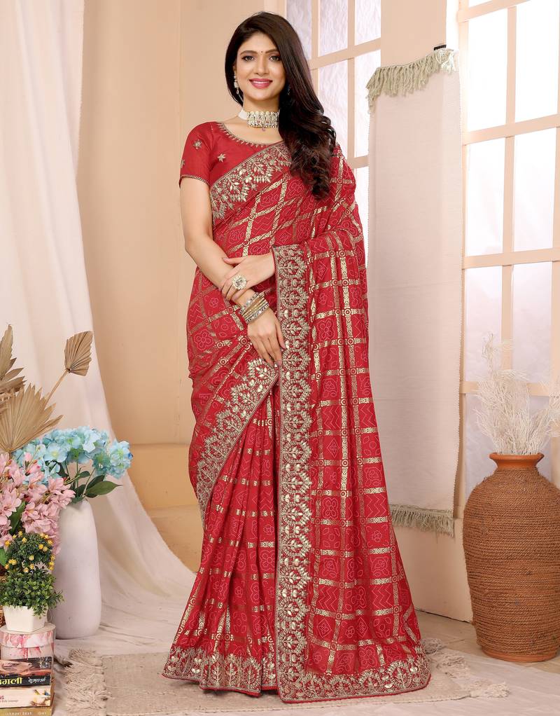 Red bandhani printed vichitra silk saree with embroidered border
