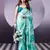 rama green satin saree with printed leaf motifs