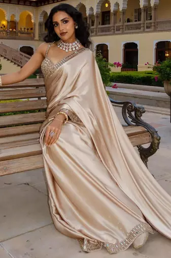 beige satin saree with mirror embroidery border