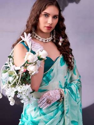 rama green satin saree with printed leaf motifs 2