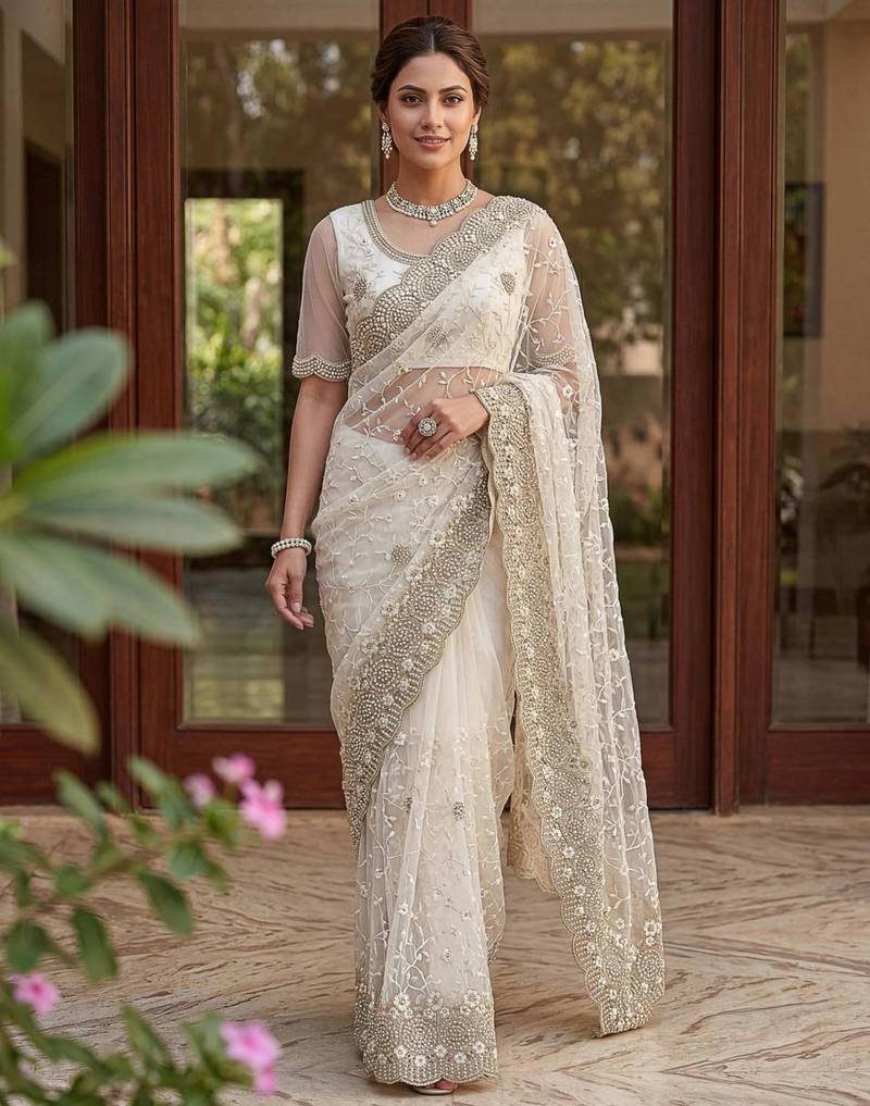 Off white net embroidered saree