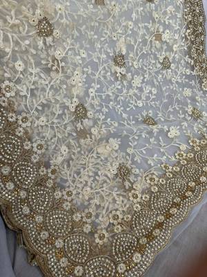 off white net saree with floral embroidery work 5