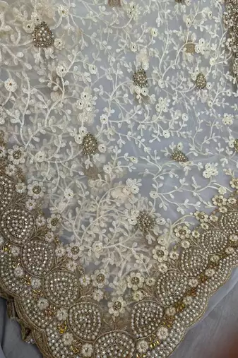 off white net saree with floral embroidery work