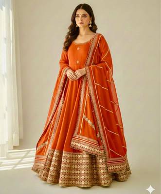 orange silk blend anarkali gown set with embroidered border


 1