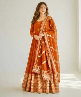 orange silk blend anarkali gown set with embroidered border


 3