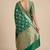 Banarasi semi silk saree in  green colour with  floral zari jaal  work