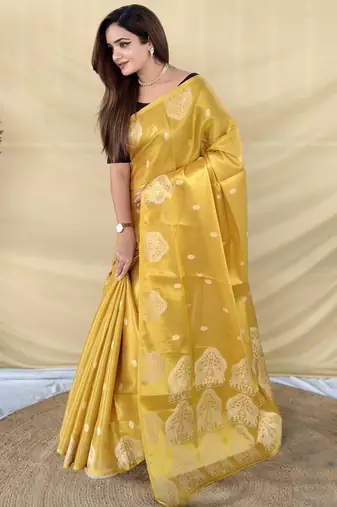 yellow tissue saree with zari elephant border design