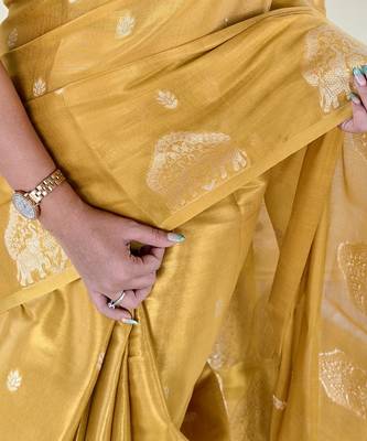 yellow tissue saree with zari elephant border design 4