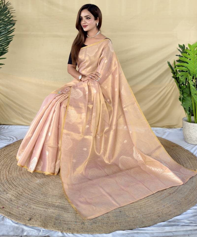 Light pink  zari tissue weaving saree with all over elephant pattern motifs on border