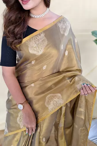green tissue saree with zari elephant motif border