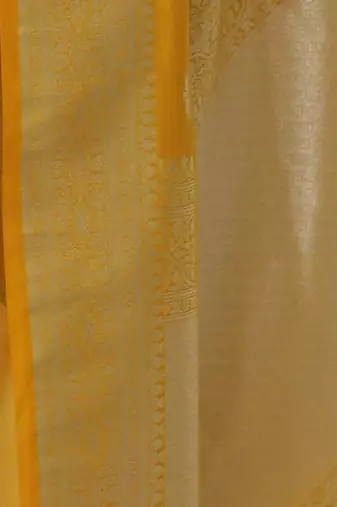 yellow art silk kanjeevaram saree with woven zari design