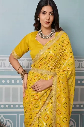 yellow art silk bandhani saree with sequinned work