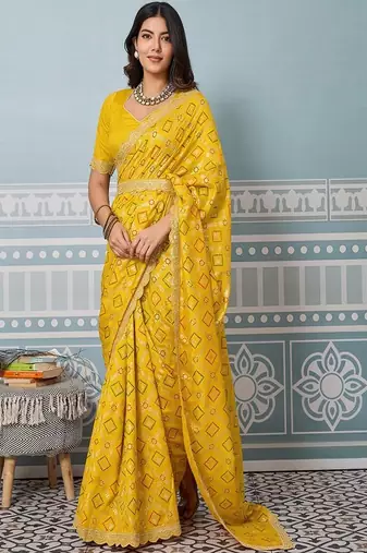 yellow art silk bandhani saree with sequinned work