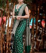 green art silk kanjeevaram saree with woven zari motifs