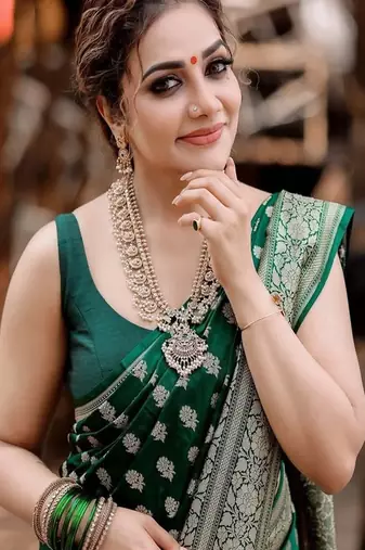 green art silk kanjeevaram saree with woven zari motifs