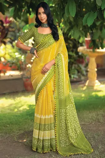 Yellow ethnic motifs printed ikat saree