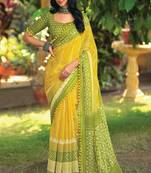 Yellow ethnic motifs printed ikat saree