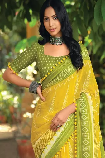 Yellow ethnic motifs printed ikat saree