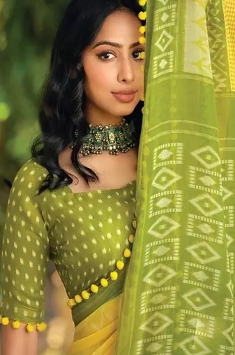 Yellow ethnic motifs printed ikat saree