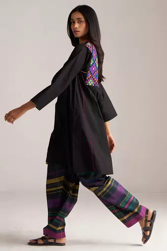 black co-ord set with multi colour checkered pants